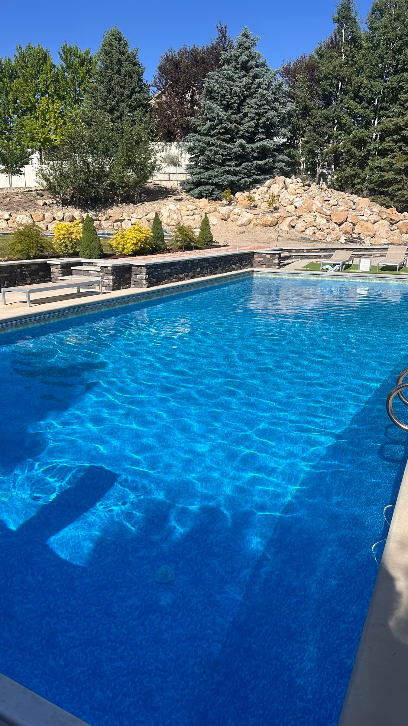 Crystal clear backyard swimming pool in Utah